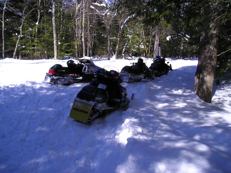 P1010010.JPG - Several snowmobilers passed us on the way up to the top. When we arrived they were all at the ledge looking at the view.