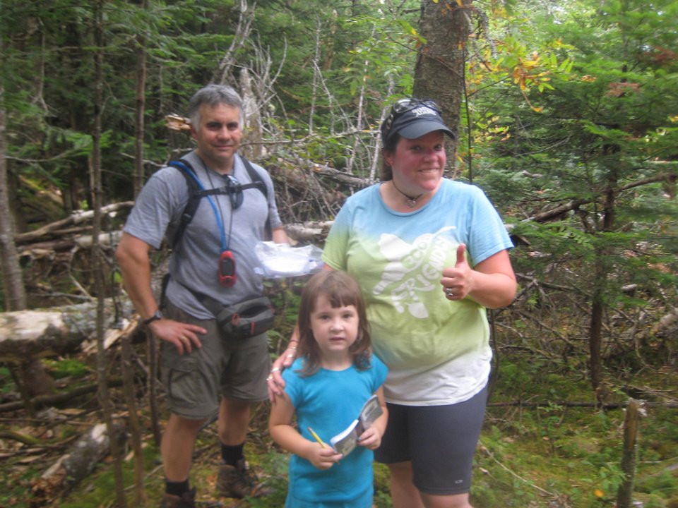 IMG_5265.JPG - Tim and Danielle celebrating with Mckinlee on her first geocache.